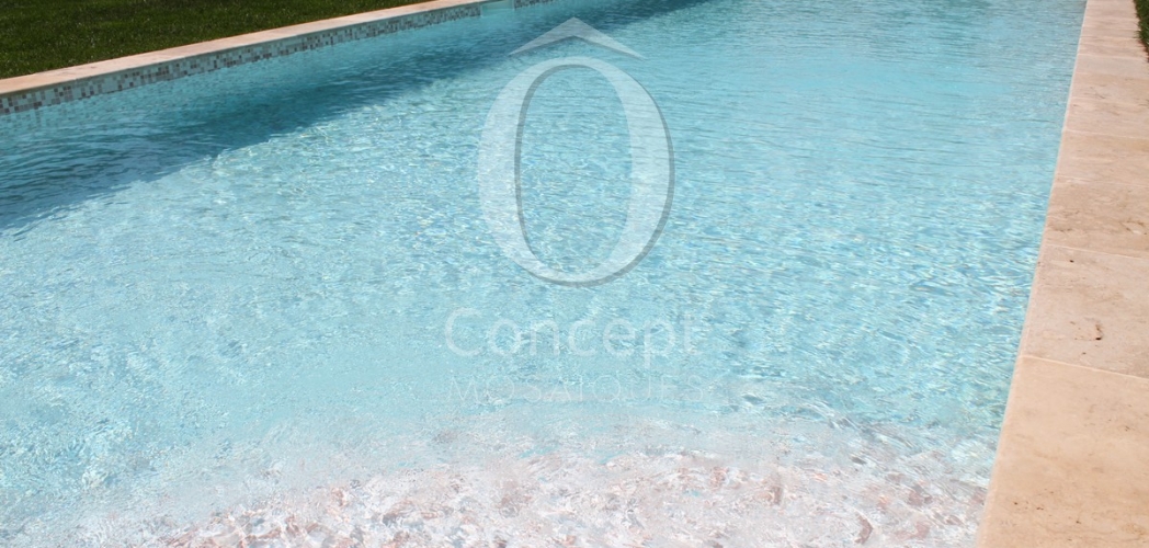 Blue swimming pool made of Rose Quartz, a mosaic tiles mix created by Ô Concept