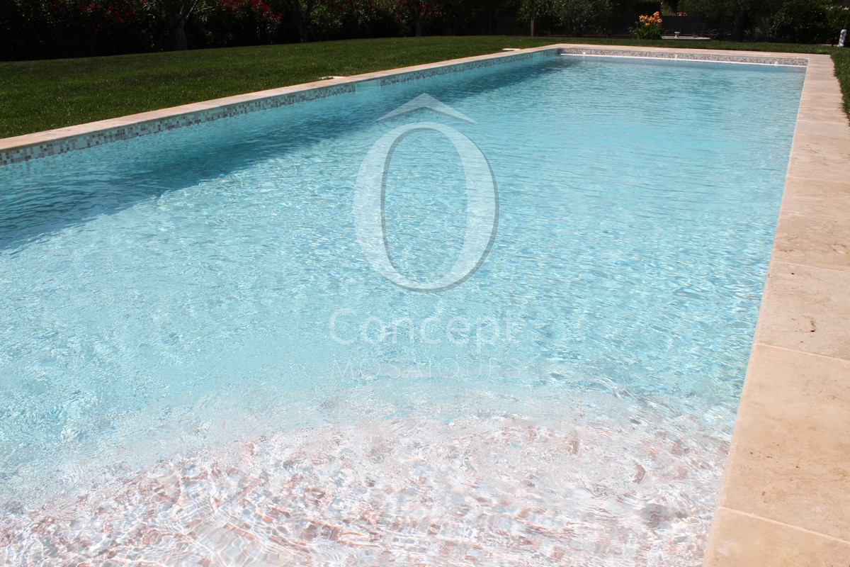 Blue swimming pool made of Rose Quartz, a mosaic tiles mix created by Ô Concept
